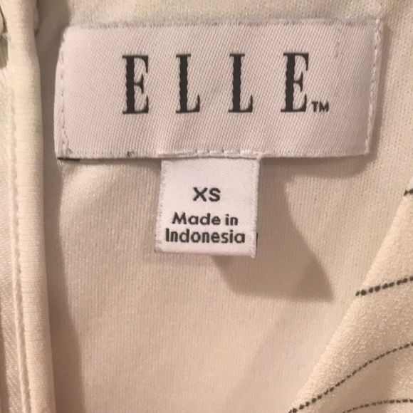 ELLE Asymmetrical Striped Sleeveless Peplum Top - Picture 8 of 10